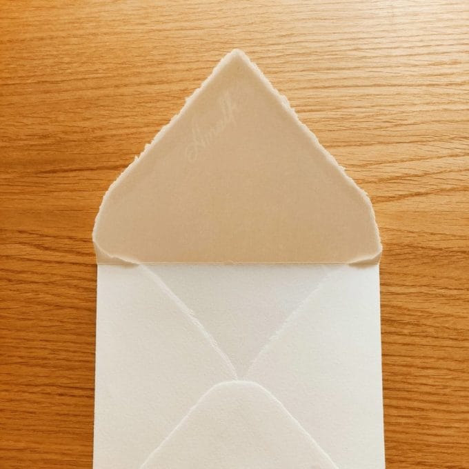 Square envelope in ivory Amalfi paper with open flap and watermark in plain view