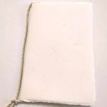Amalfi paper wedding booklet with ivory color cover with straw. Size 11 x 17 cm.