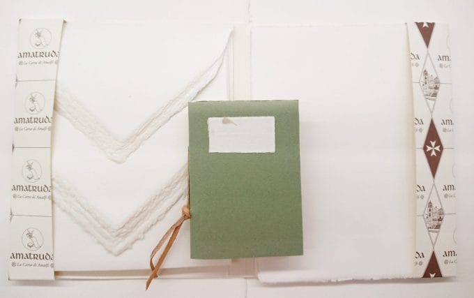 Gift idea in Amalfi paper. Handmade paper sheets and envelopes in addition to a handmade bound notebook with green cover