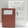 Gift box with sepia notebook in combination with envelopes and stationery