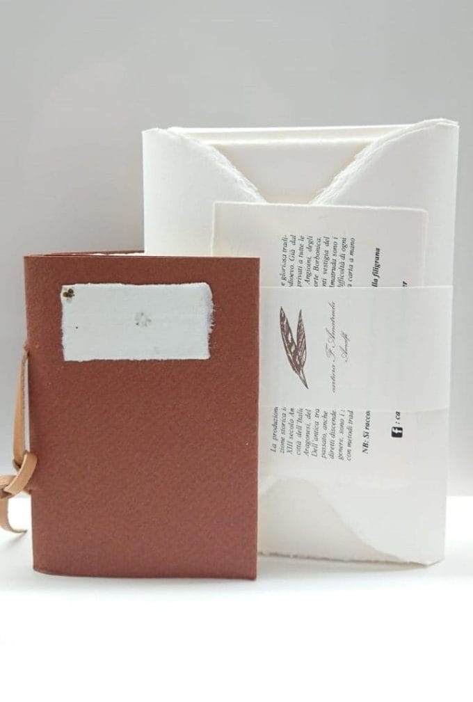Gift box with sepia notebook in combination with envelopes and stationery
