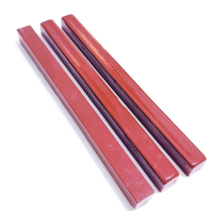 Burgundy-coloured bars for sealing wax on Amalfi paper invitations.