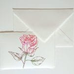 Amalfi paper place cards decorated with red rose