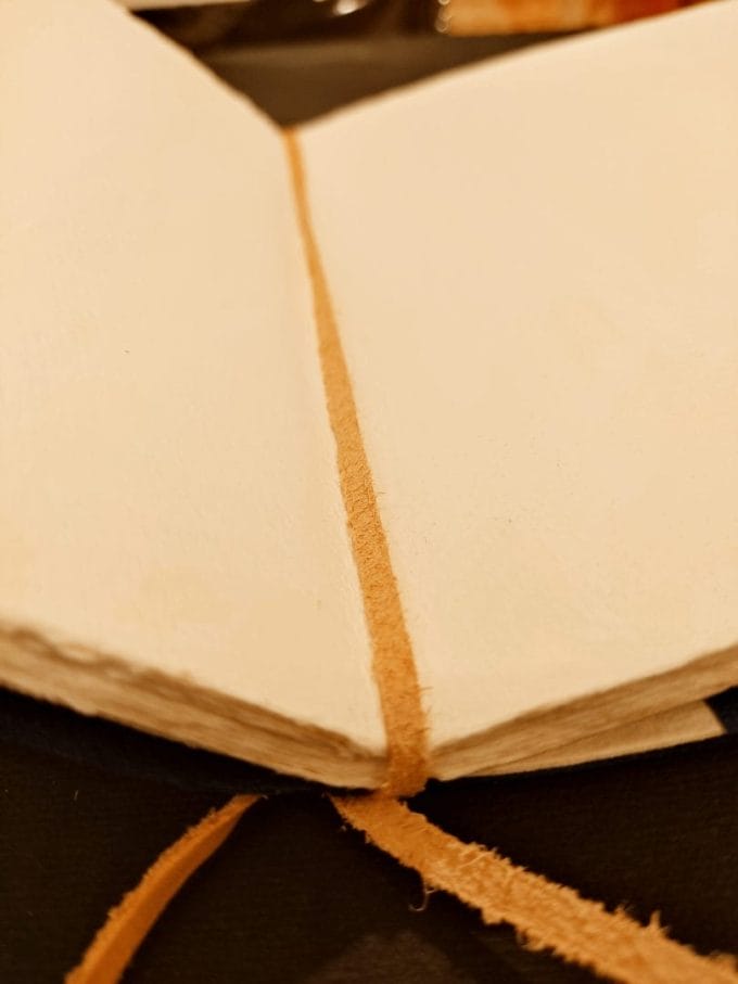 Interior detail. Leather lace closure for convenient sheet replacement