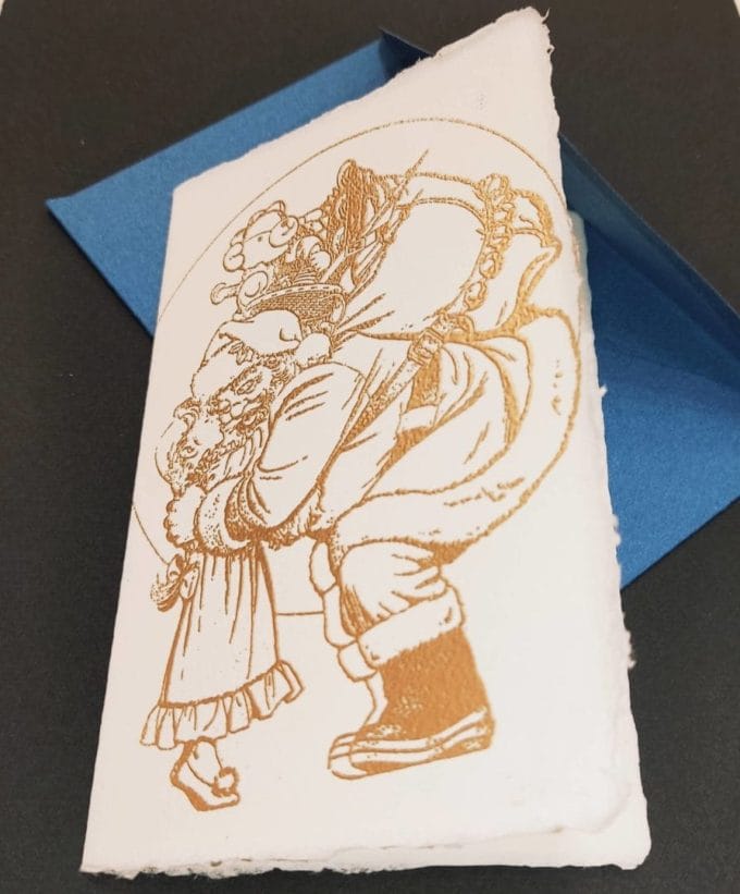 Amalfi paper folding cards with handmade illustration with handmade relief gilding. On the front of the card the illustration entitled "Santa Claus is coming to town".