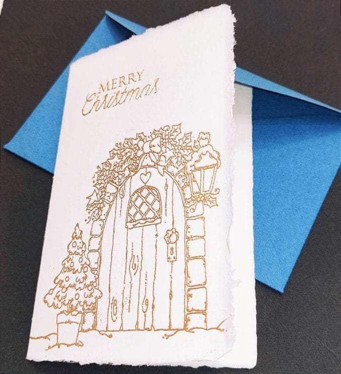 Amalfi paper folding cards with classic Christmas mistletoe decoration made with handmade embossed gilding.