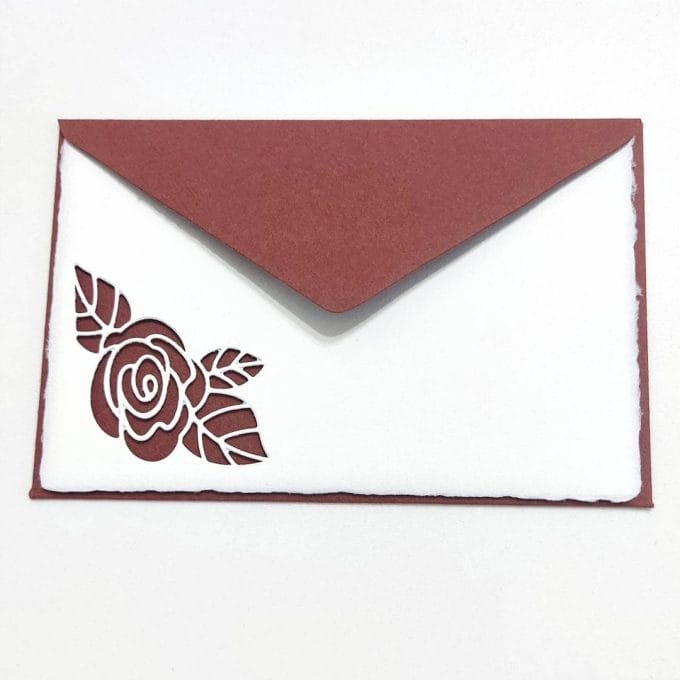 Amalfi paper cards with perforated rose and sepia envelopes.
