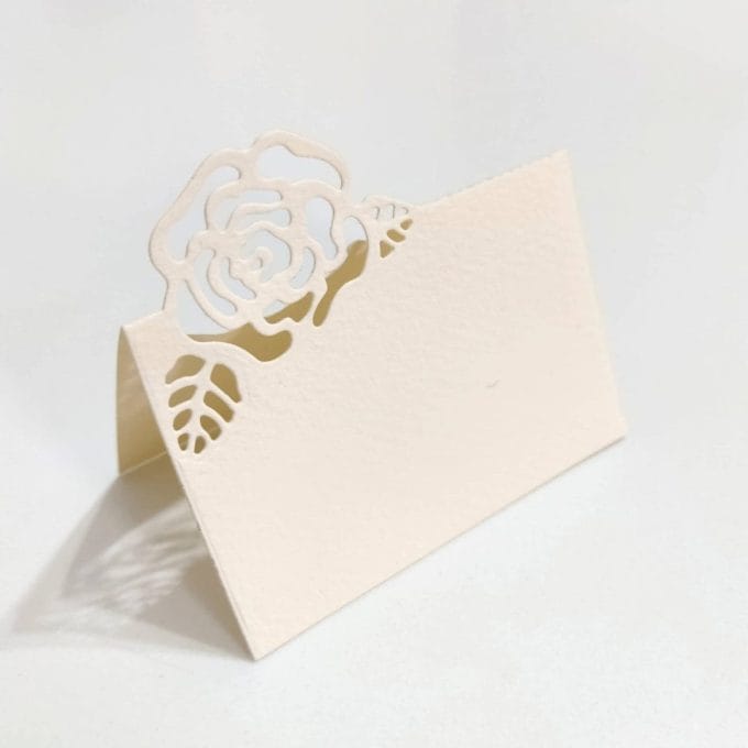 Placeholder for wedding made of ivory pink perforated Amalfi paper. The decoration of a rose, is handmade by the artistic workshop of Lo Scrigno di Santa Chiara.