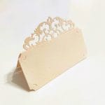 Laser cut place card in Amalfi paper with baroque style fretwork. Ivory pink color.