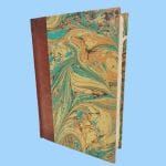 Amalfi paper agenda and cover with leather spine and marbled paper. Size 13 x 18cm.